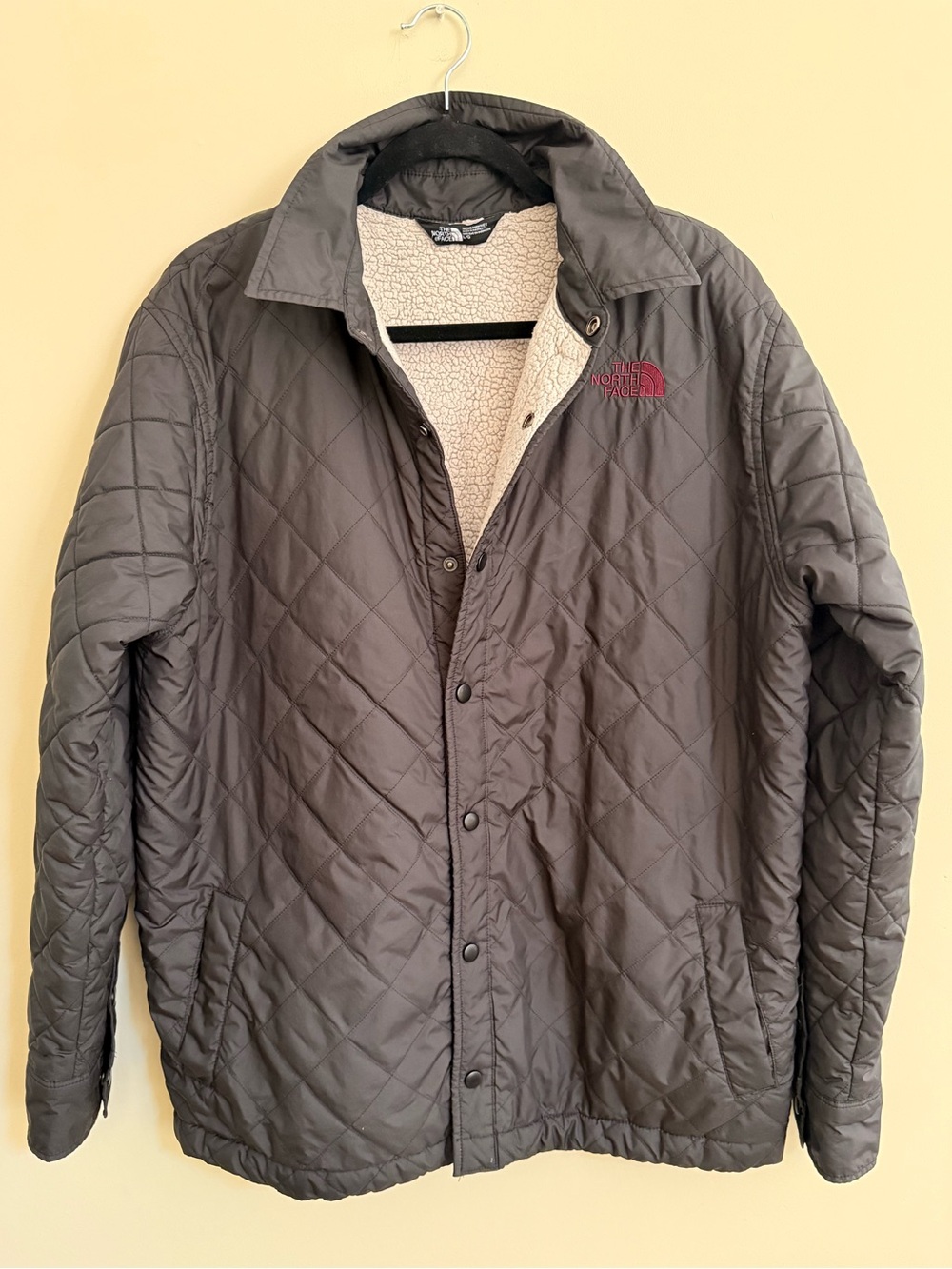 GUC size Large The North Face Men's Black Quilted Jacket with fleece lining.